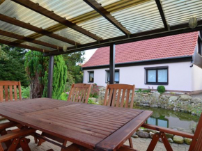 Apartment in the Harz with a log cabin pond and covered seating area